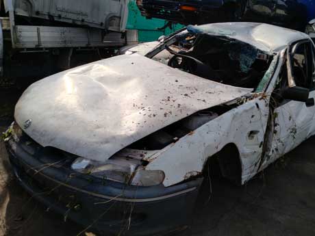 A car with accident damage to the front quarter panel